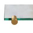 Brass shelf clamp fitted to the corner of a clear glass shelf