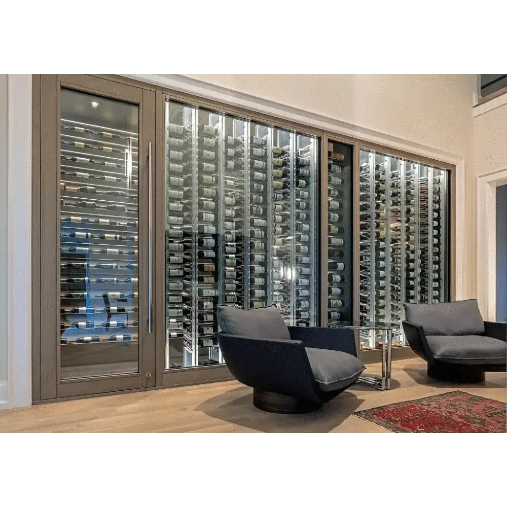Glass-fronted wine wall with metal peg racking in a living room, cooled by a Wine Guardian cabinet system